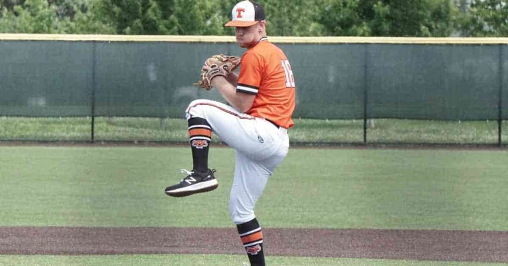 A RHP right-handed pitcher in an orange and white uniform - What Does RHP Mean in Baseball?