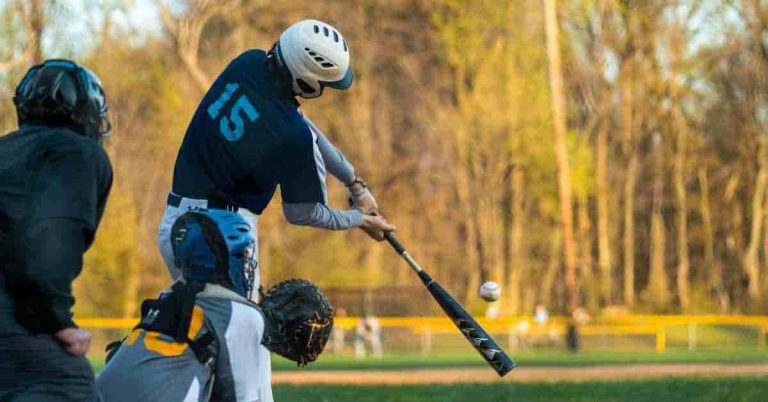 Baseball player in action, raising the question 'Is Baseball considered a Contact Sport
