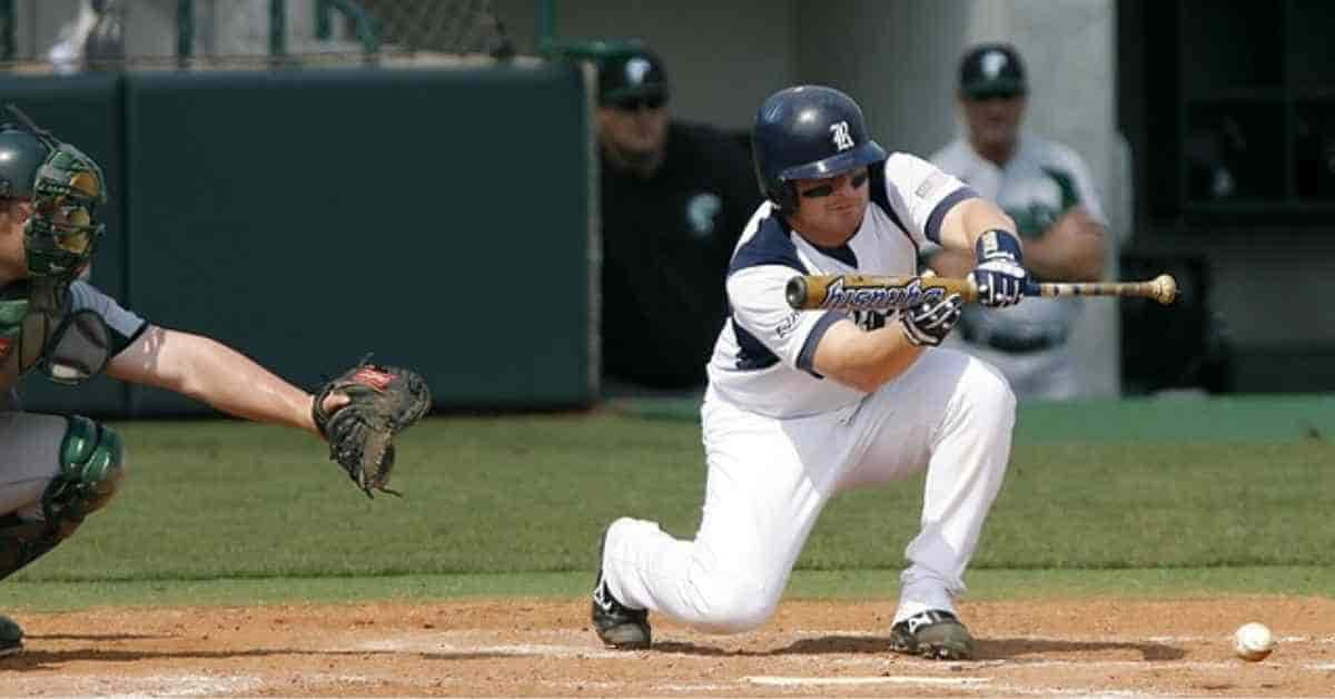 A baseball player swinging a bat at a pitch from a right-handed pitcher (RHP)