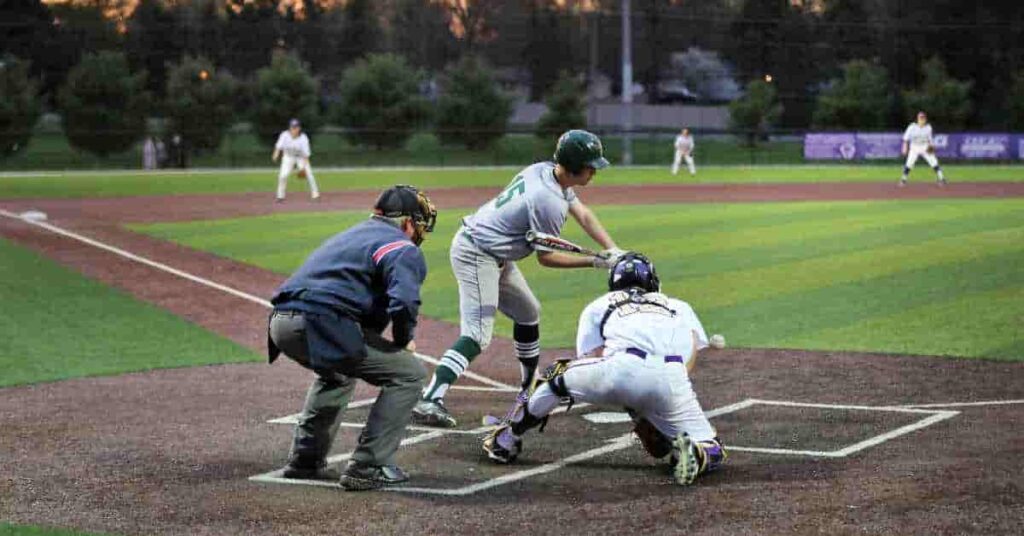 A group of men on a field playing baseball, showcasing the competitive 'war in baseball.