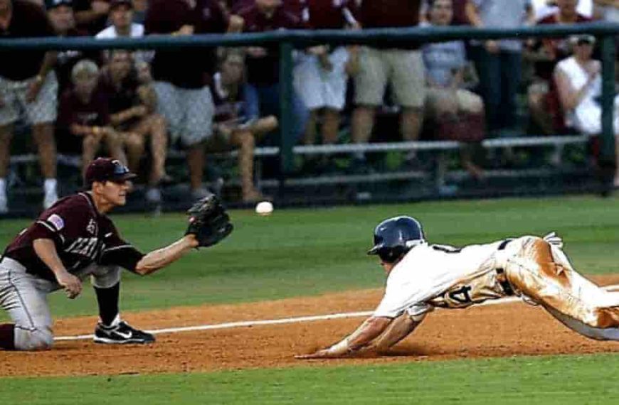 A baseball player sliding into a base during a game, a crucial moment that can determine What is a walk-off in baseball.