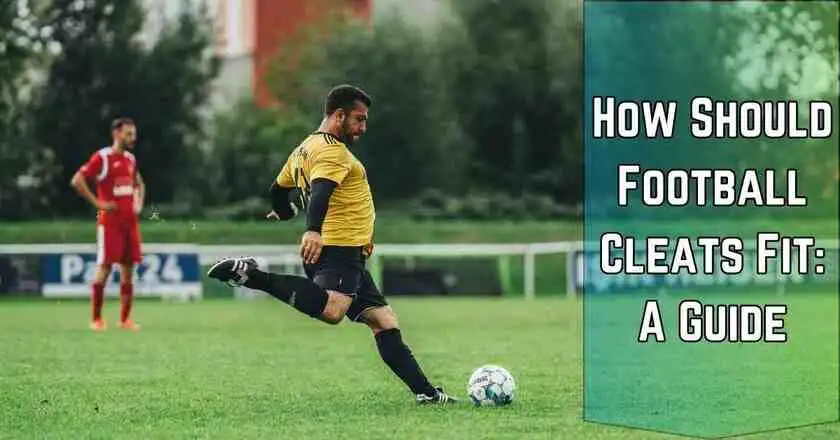 A man wearing football cleats kicking a soccer ball on a field, demonstrating how football cleats fit