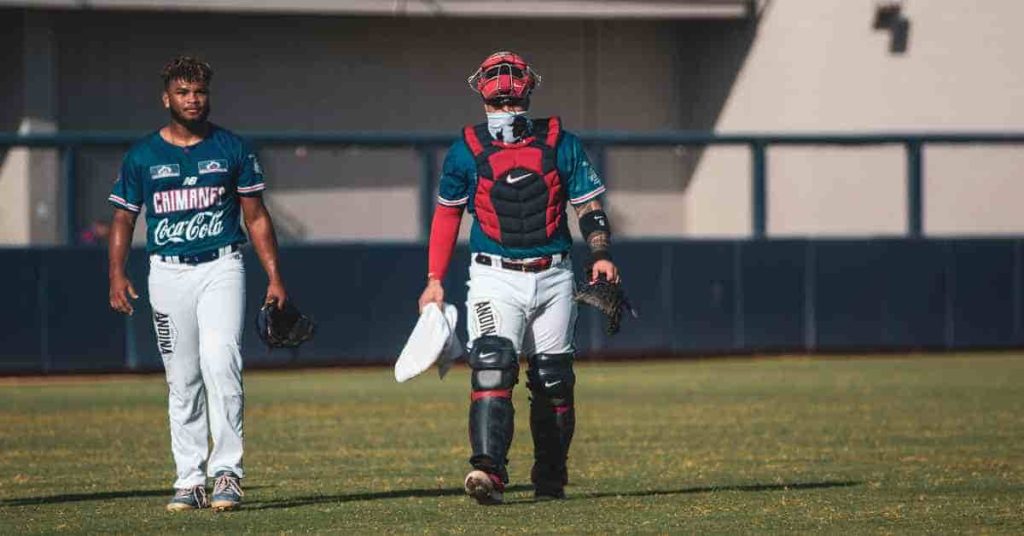 A couple of baseball players walking across a field, illustrating the concept of What is a walk-off in baseball.