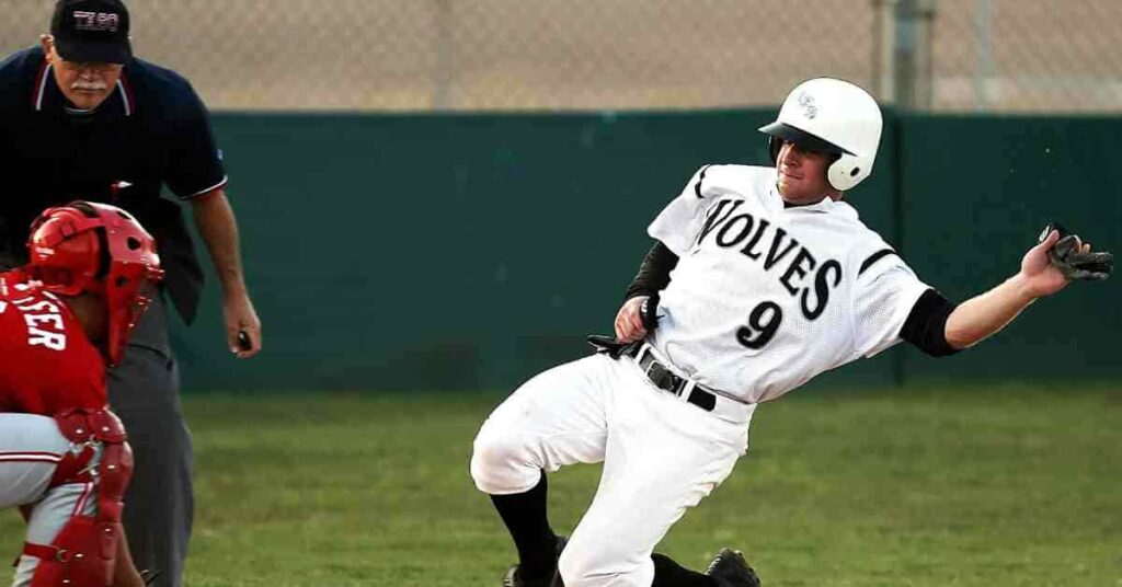 Matt Olson, a baseball player, sliding into a base during a game.