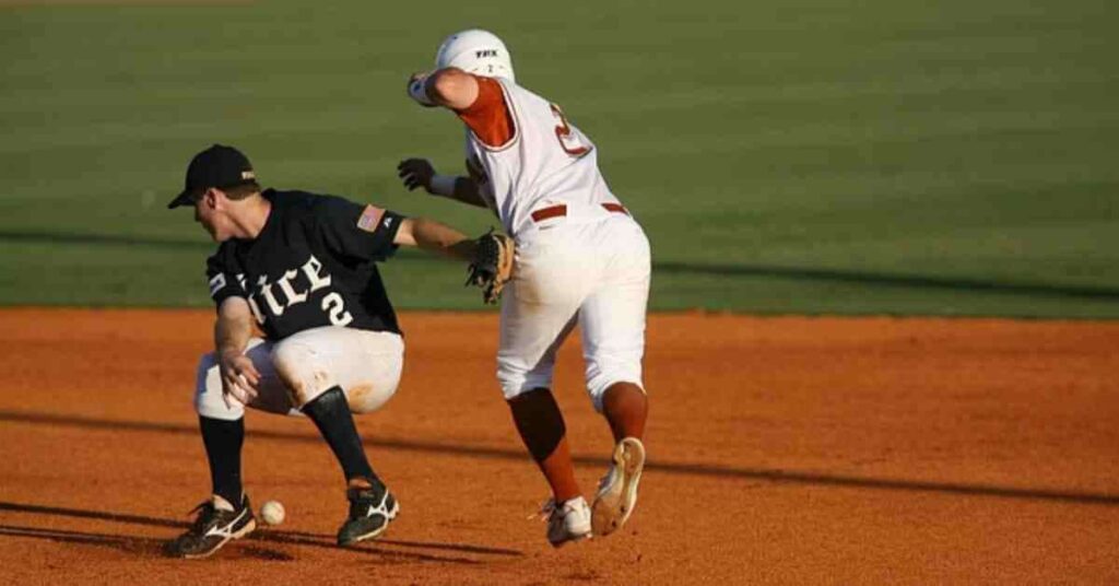 Matt Olson and another man standing on top of a baseball field.