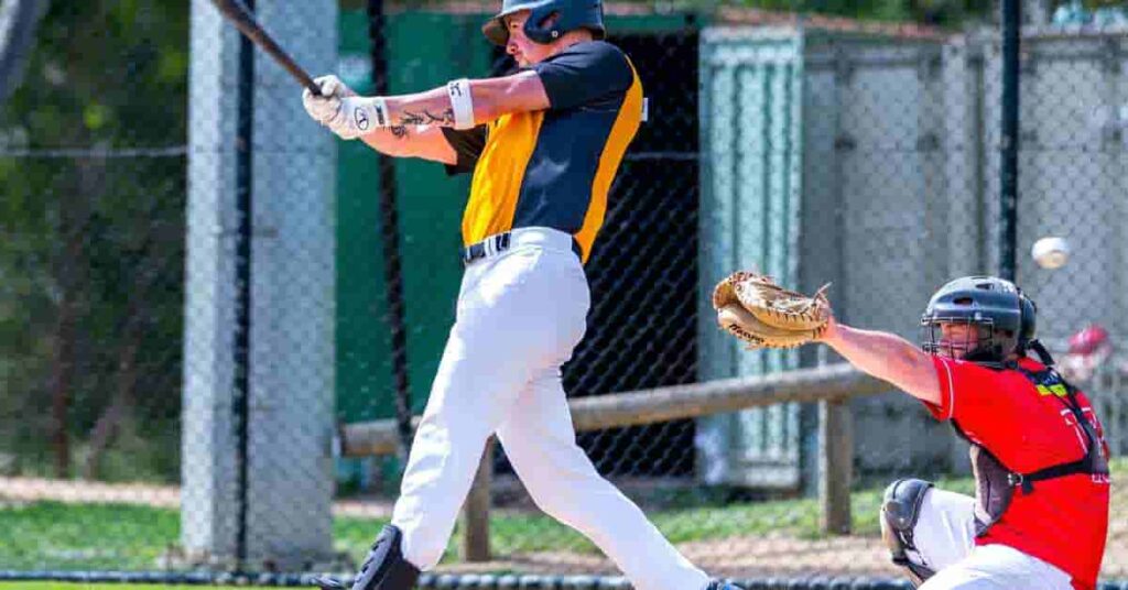 A baseball player swinging a bat at a ball, highlighting baseball's inclusion in the Summer Olympics