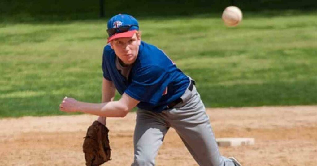 Zack Wheeler throwing a ball on a baseball field.