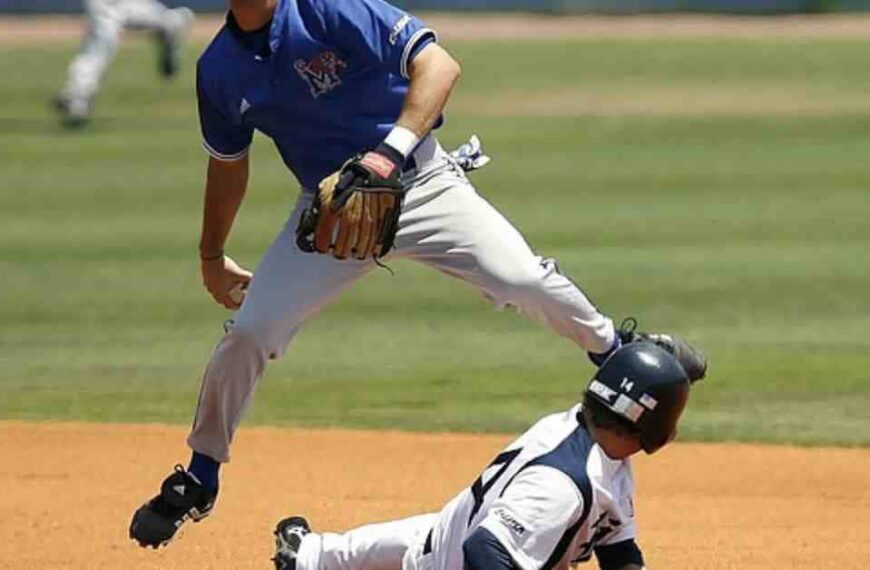 A Nationals top prospect baseball player sliding into a base during a game.