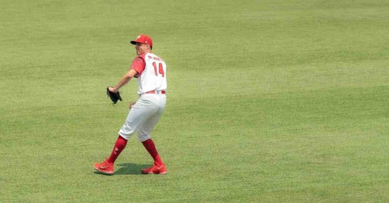 Yariel Rodriguez, a baseball player, standing on top of a field.