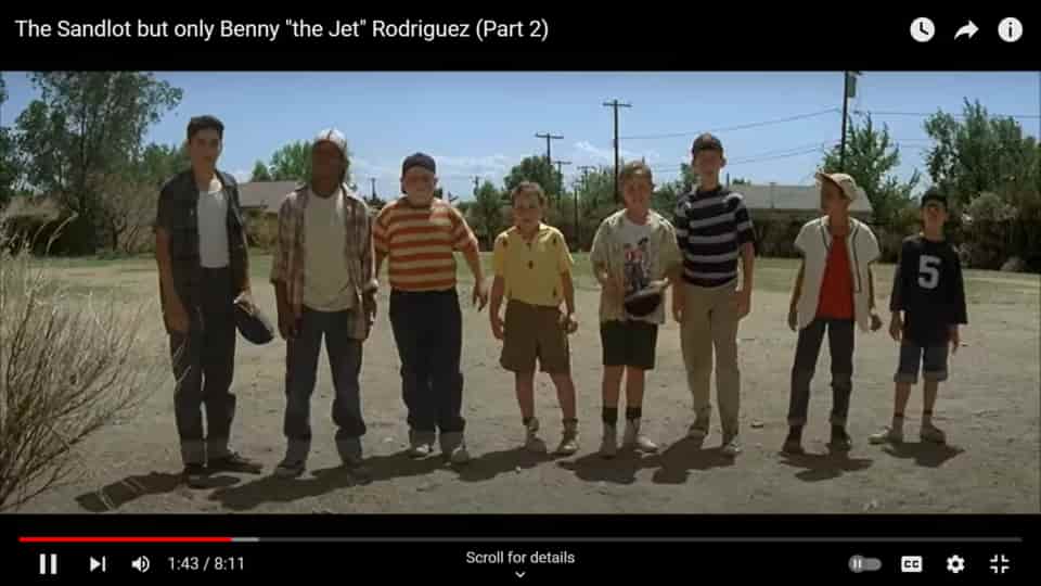 Benny Rodriguez- The Legend of The Sandlot 2 Benny Rodriguez and a group of kids standing together in a dusty field, wearing colorful shirts and shorts, with trees and telephone poles in the background.