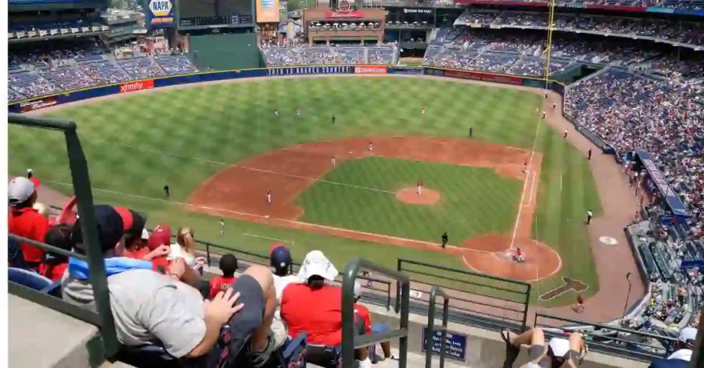 How Many Acres For a Baseball Field- An Ultimate Guide To Baseball 2 A baseball game is being played in a stadium on a baseball field.