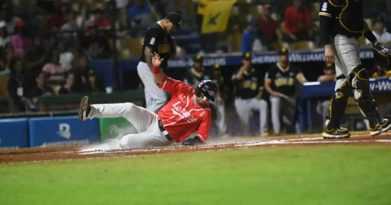 A baseball player sliding into a base during a game, with a question about balk in baseball .