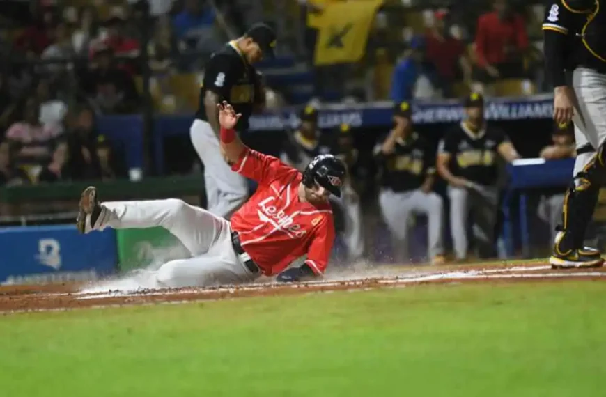 A baseball player sliding into a base during a game, with a question about balk in baseball .