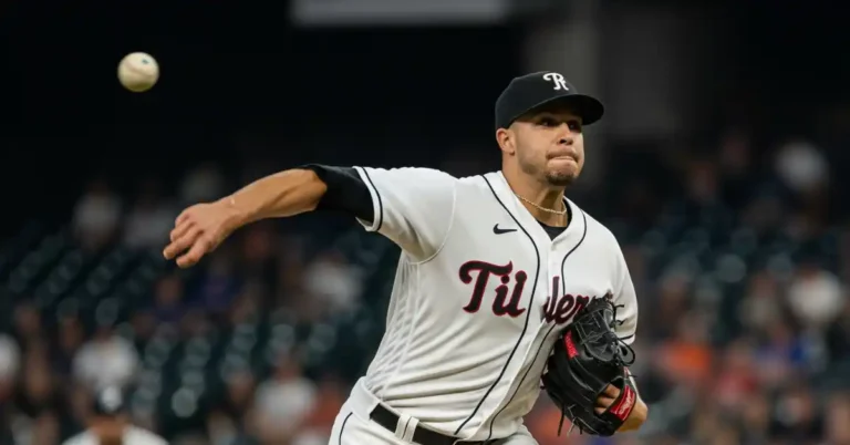 Garrett Richards, a baseball pitcher in a white jersey with black accents, throws a baseball, showcasing a dynamic windup on the mound.